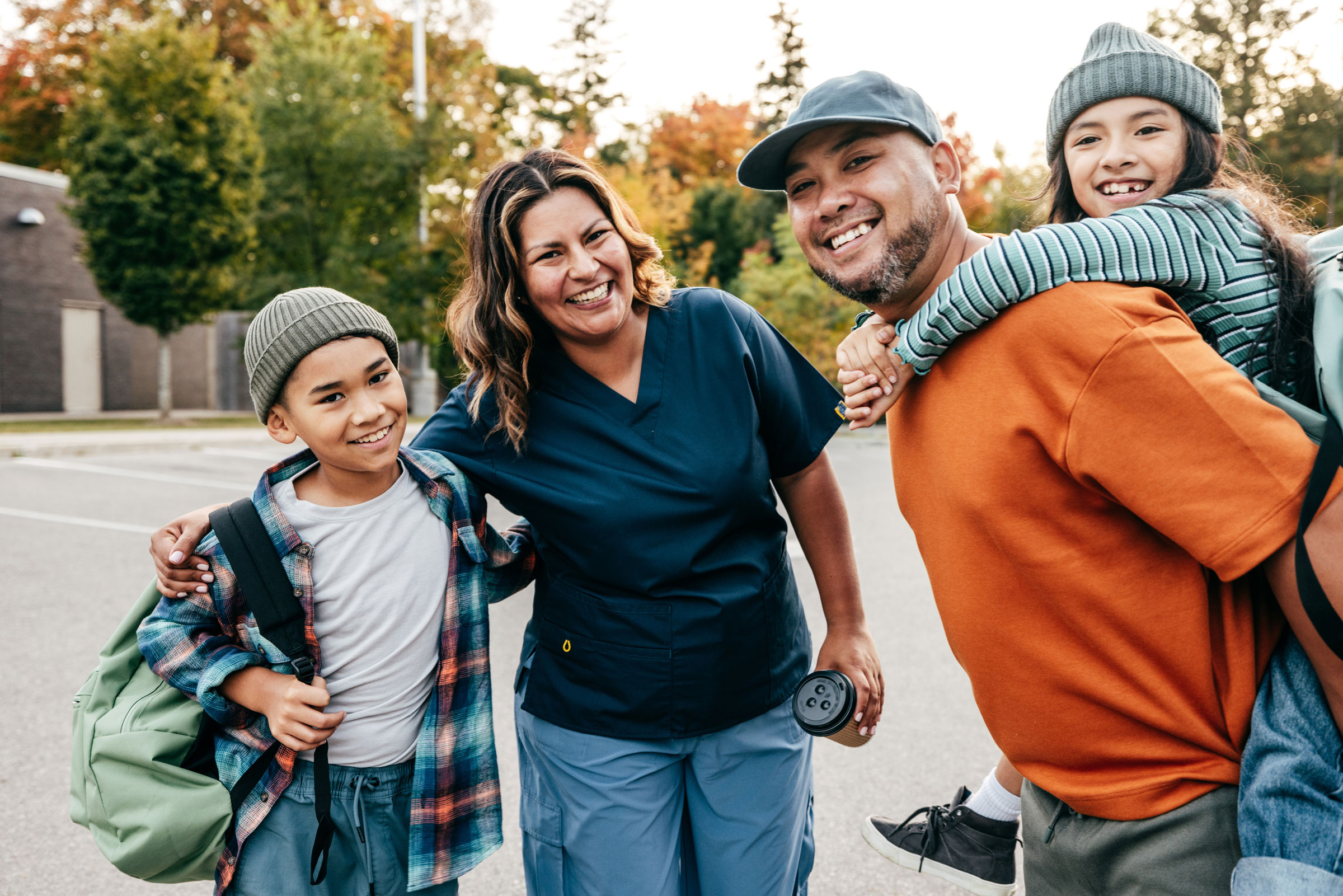 A mom and dad spend time with their two kids.